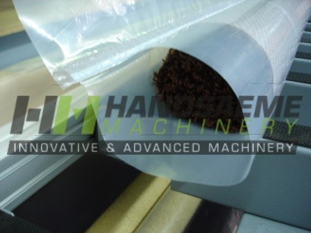 Push in packing machine for textile rolls
